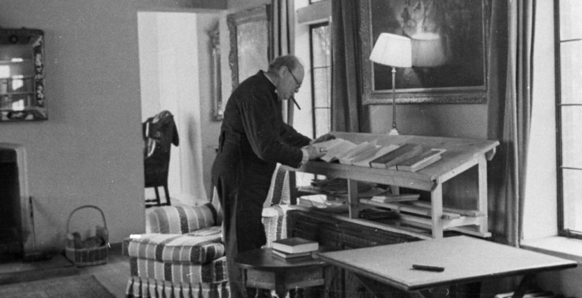 Churchill writing at his desk