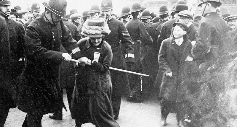 Black Friday, 18 November 1910: A policeman attempts to seize the banner pole of a suffrage demonstrator. (Daily Mirror, Wikimedia Commons)