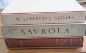 The two chief varieties, in “parchment” paper with red decorations, and grey-blue laid paper with the illustrator’s name added to the spine