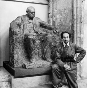 The sculptor with his massive seated Churchill