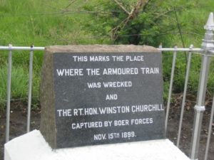 Monument that reads This marks the place where the armored train was wrecked and the R.T. Hon. Winston Churchill captured by Boer Forces 11/15/1899.