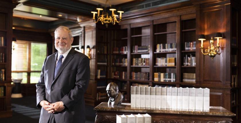 Larry Arnn with Churchill Document Volumes