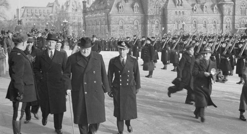 Winston Churchill, flanked by detective Walter Thompson and naval aide Cdr. “Tommy” Thompson